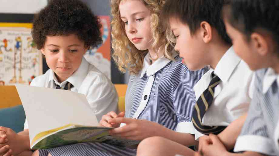 Schoolchildren reading.