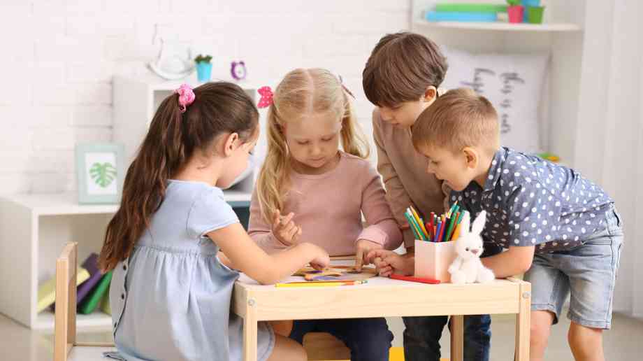 Young children colouring