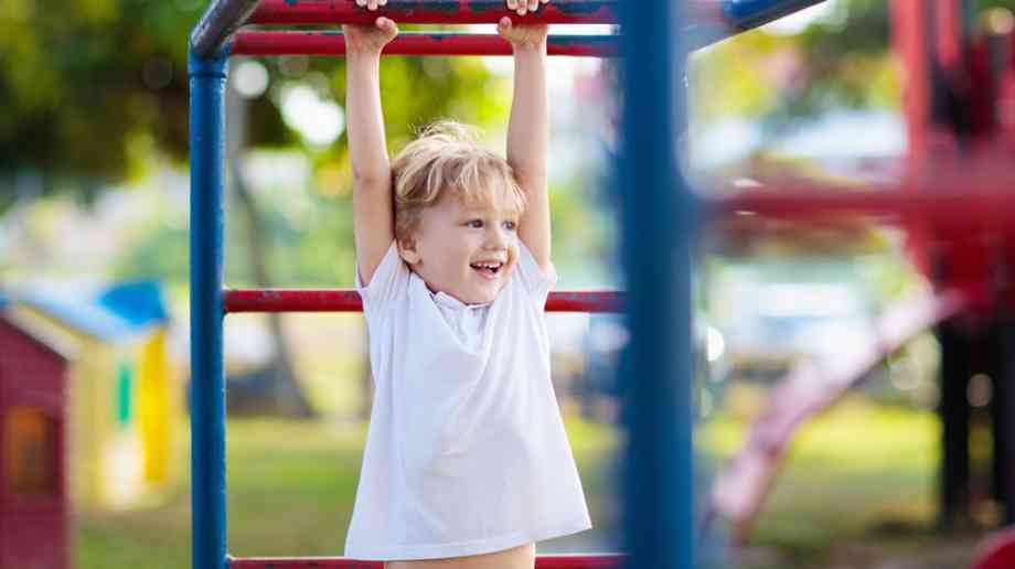 Child on monkey bars