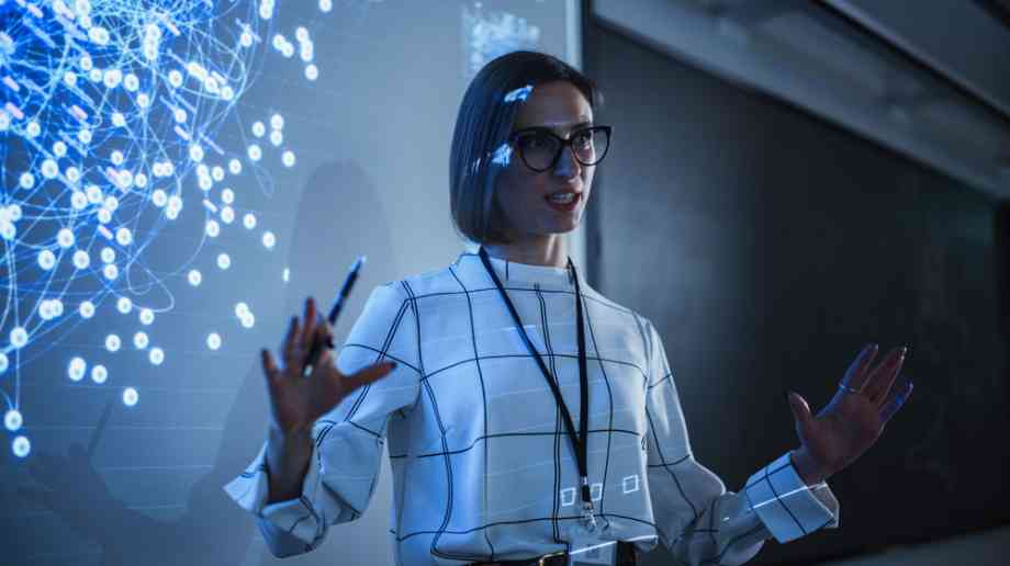 Teacher working with tech