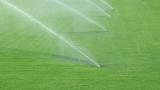 Grass pitch with sprinklers