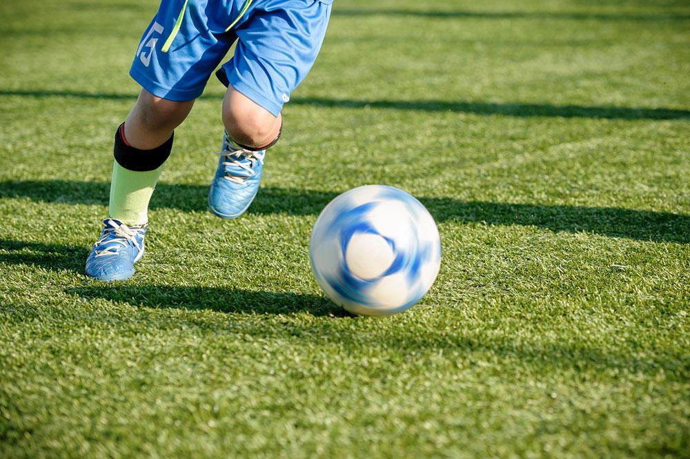 Boy playing football