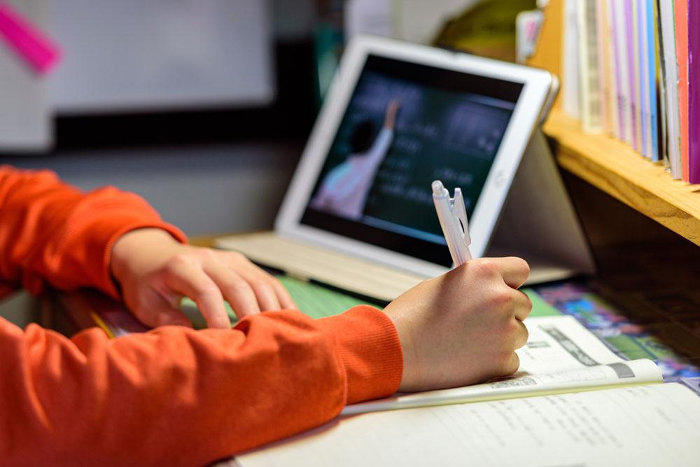 Child doing homework on ipad